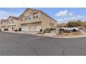 Attractive townhome with garages, manicured landscaping, and street parking at 9323 Leaping Deer Pl # 102, Las Vegas, NV 89178