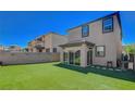 Spacious backyard with artificial turf and covered patio at 12525 Lylan Ridge St, Las Vegas, NV 89138