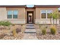 Welcoming entryway with stone and brick details at 144 Stone Mesa Ct, Henderson, NV 89011