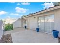 Private patio with concrete flooring, potted plants, and access to the interior at 2136 Chertsey Dr # A, Las Vegas, NV 89108