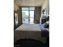 Bedroom with city views and private balcony access at 353 E Bonneville Ave # 631, Las Vegas, NV 89101