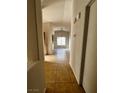 Bright hallway with tile flooring and view into dining area at 3710 Royal Fern Cir, Las Vegas, NV 89115