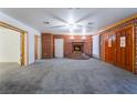 Living room with brick fireplace and grey carpet at 3759 Glen Ave, Las Vegas, NV 89121