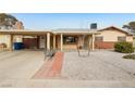 Ranch style home with carport, landscaped yard, and covered entryway at 3766 Millwood Ave, Las Vegas, NV 89121