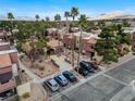 Aerial view of community showing building exteriors, parking, and landscaping at 4050 Pacific Harbors Dr # 201, Las Vegas, NV 89121