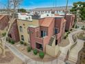 Exterior view of building with entrance and walkway, showcasing architectural details at 4050 Pacific Harbors Dr # 201, Las Vegas, NV 89121