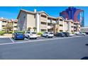 View of apartment building parking lot with several cars parked at 4200 S Valley View Blvd # 2081, Las Vegas, NV 89103