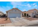 One story house with a single car garage and desert landscaping at 424 Sarajane Lane, Las Vegas, NV 89107