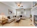 Spacious living room featuring neutral colors, fireplace, and ample natural light at 448 Bright Moon Ave, North Las Vegas, NV 89084