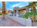 Inviting single-story home with a charming front patio and well-maintained landscaping, perfect for relaxing outdoors at 471 Eagle Vista Dr, Henderson, NV 89012