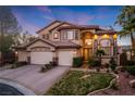 Beautiful two-story home with a three-car garage, desert landscaping and solar panels at 5734 San Florentine Ave, Las Vegas, NV 89141