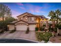 Charming two-story home boasting a three-car garage, tile roof, and manicured landscaping at dusk at 5734 San Florentine Ave, Las Vegas, NV 89141