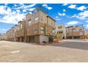 Modern three-story townhome community with attached garages at 671 Sentinel Spire St, Las Vegas, NV 89138