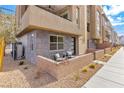 Private patio with seating area, next to a townhome at 671 Sentinel Spire St, Las Vegas, NV 89138