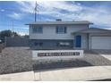 Charming two-story home with attached garage, low-maintenance front yard, and decorative address display at 7237 William Anders Ave, Las Vegas, NV 89145