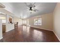 Spacious living room with tile floors and ceiling fan at 8212 Bolingbrook Ave, Las Vegas, NV 89149