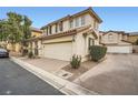 Two-story house with attached garage and driveway at 947 Cantabria Heights Ave, Las Vegas, NV 89183