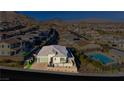 Aerial view of a house in a community with a pool at 11700 Belorado Ave, Las Vegas, NV 89138