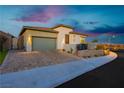 Modern home with attached garage and attractive landscaping at 11700 Belorado Ave, Las Vegas, NV 89138