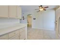 Bright kitchen with light cabinets and tile floor at 1830 N Buffalo Dr # 1007, Las Vegas, NV 89128