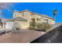 Two-story house with attached garage and desert landscaping at 2526 Rocky Countryside St, North Las Vegas, NV 89030