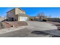 Two-story house with driveway and landscaped yard at 2526 Rocky Countryside St, North Las Vegas, NV 89030