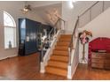 Modern staircase with wood steps and metal railing leading to upper level at 3008 Blue Fin Cir, Las Vegas, NV 89128