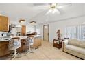 Bright, open-concept living space featuring tile floors and neutral color palette at 3381 W Simkins Rd, Pahrump, NV 89060