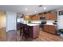 Kitchen island with stainless steel appliances and wood cabinets at 3811 E Chaffe Ave, Pahrump, NV 89061