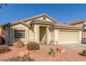 Single story house with attached garage and desert landscaping at 4826 Polar Lights Ct, Las Vegas, NV 89130