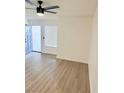 Bright living room with light flooring and a ceiling fan at 4928 Nellie Springs Ct, Las Vegas, NV 89110