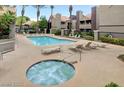 Relaxing pool and spa area with lounge chairs at 5006 S Rainbow Blvd # 103, Las Vegas, NV 89118