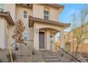 Two-story house with brown roof and desert landscaping at 524 Celebratory Pl, Henderson, NV 89011