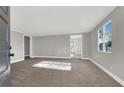 Spacious living room with neutral walls and carpet flooring at 649 Federal St, Henderson, NV 89015