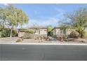 Charming single-story home with desert landscaping and a two-car garage at 7288 Olsen Farm St, Las Vegas, NV 89131