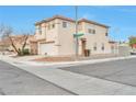 Two-story house showcasing a side view, landscaping, and street view at 7732 Prosperity River Ave, Las Vegas, NV 89129