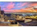 Community overview showcasing homes with city views at sunset at 12073 Glentana View St, Las Vegas, NV 89138