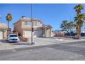 Two-story house with a driveway and street view at 2000 Golden Shadow Ct, Henderson, NV 89002