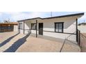 Newly remodeled home with a modern exterior and a gravel front yard at 214 W Atlantic Ave, Henderson, NV 89015