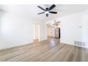 Bright living room with light wood floors and a ceiling fan at 214 W Atlantic Ave, Henderson, NV 89015