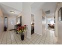 Bright and spacious entryway with tile floors and a view to other rooms at 2353 Moorpark Way, Henderson, NV 89014