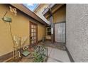 Front entrance with a gated courtyard and tile flooring at 2353 Moorpark Way, Henderson, NV 89014