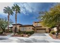 Two-story house with tile roof, stucco siding, and a three-car garage at 2475 Grassy Spring Pl, Las Vegas, NV 89135