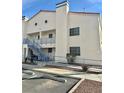 Two-story condo building with stairs and desert landscaping at 2725 S Nellis Blvd # 2036, Las Vegas, NV 89121