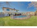 Spacious backyard featuring a well-maintained lawn and a fenced swimming pool, ideal for Gathering enjoyment and outdoor activities at 4008 Snead Dr, Las Vegas, NV 89107