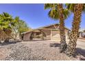 House exterior with palm trees and gravel landscaping at 427 Shamrock Dr, Henderson, NV 89002