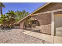 Wrought iron gate leads to a cozy patio seating area at 427 Shamrock Dr, Henderson, NV 89002