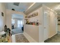 Bright entryway with tile flooring, high ceilings, and built-in shelving at 5417 Lemhi Ct, North Las Vegas, NV 89031