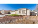 House exterior showcasing a well-maintained lawn and attractive landscaping at 5417 Lemhi Ct, North Las Vegas, NV 89031