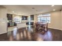Open kitchen featuring dark cabinetry, stainless steel appliances, and breakfast nook at 5490 Tulip Hill Ave, Las Vegas, NV 89141